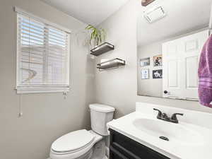 Bathroom with toilet and vanity