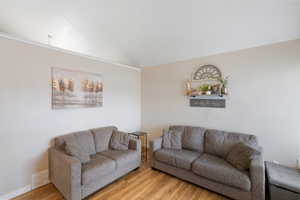 Living room with wood finished floors and baseboards