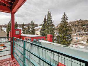 View of snow covered back of property