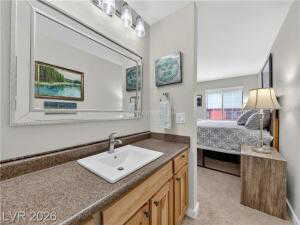 Bathroom with vanity and ensuite bathroom