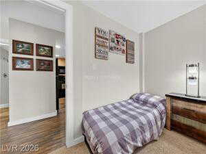 Bedroom with baseboards and wood finished floors