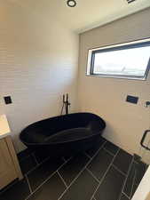 Bathroom with a soaking tub