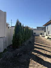Fenced backyard featuring a deck