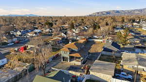 View of property location featuring mountains and nearby suburban area