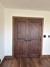 Detailed view of baseboards and wood finished floors