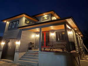 Modern home featuring a porch and stairs