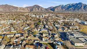 Aerial perspective of suburban area with a mountainous background