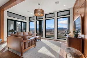 Living area featuring light wood-style floors and recessed lighting