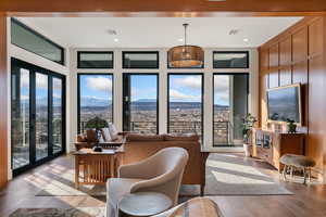 Living room with light wood-style floors and recessed lighting