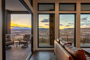Doorway with a mountain view and wood finished floors