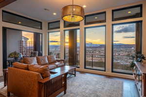 Living area featuring hardwood / wood-style flooring, a mountain view, and recessed lighting