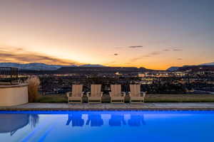Pool at dusk with a mountain view
