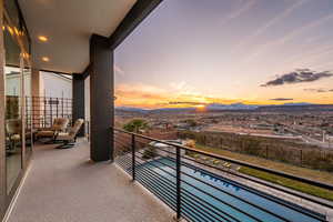 Balcony featuring view of pool and a mountain view