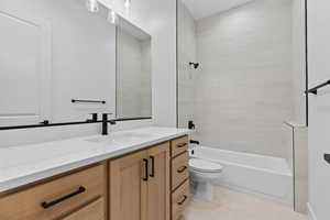 Bathroom featuring vanity and shower / bath combination