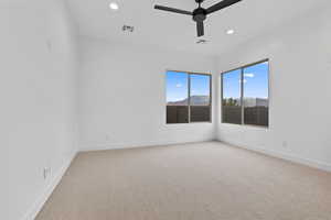Unfurnished room featuring ceiling fan, light carpet, and recessed lighting