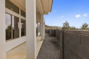 Fenced backyard featuring a mountain view