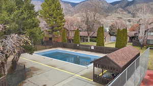 View of swimming pool featuring a mountain view and patio surround