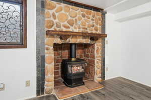 Detailed view of a wood stove and wood finished floors