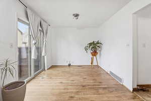Empty room with light wood-type flooring