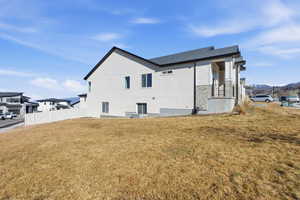 View of side of home featuring a mountain view and stone siding