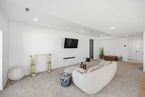 Living room featuring recessed lighting and carpet flooring