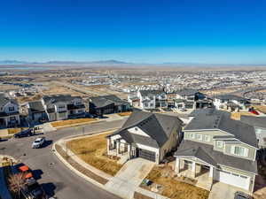 Aerial perspective of suburban area with a mountainous background