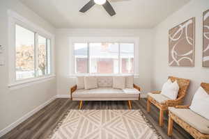 Sitting room featuring wood finished floors and ceiling fan