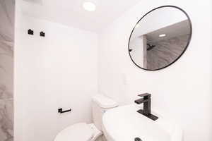 Bathroom featuring a sink and a shower