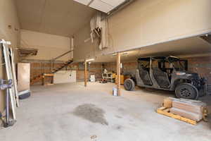 Garage featuring concrete block wall