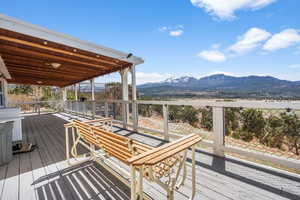 Wooden deck featuring a mountain view