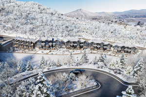Snowy aerial view with a mountain view