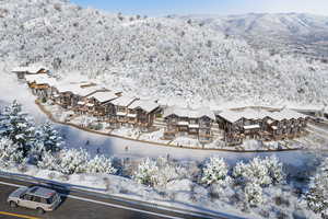 Snowy aerial view with a mountain view
