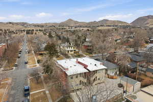 Aerial perspective of suburban area with a mountainous background