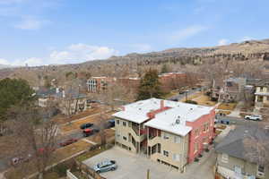 Aerial view of residential area featuring a mountainous background