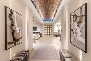 Hallway featuring wood ceiling