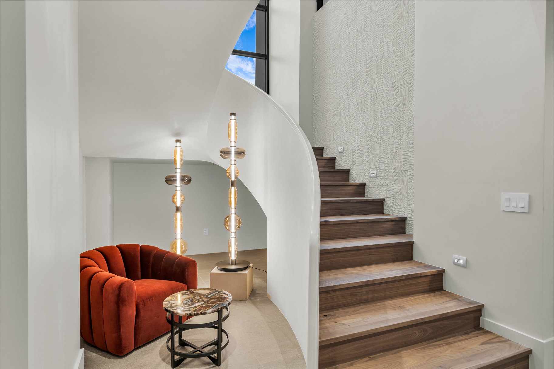 Staircase featuring a high ceiling