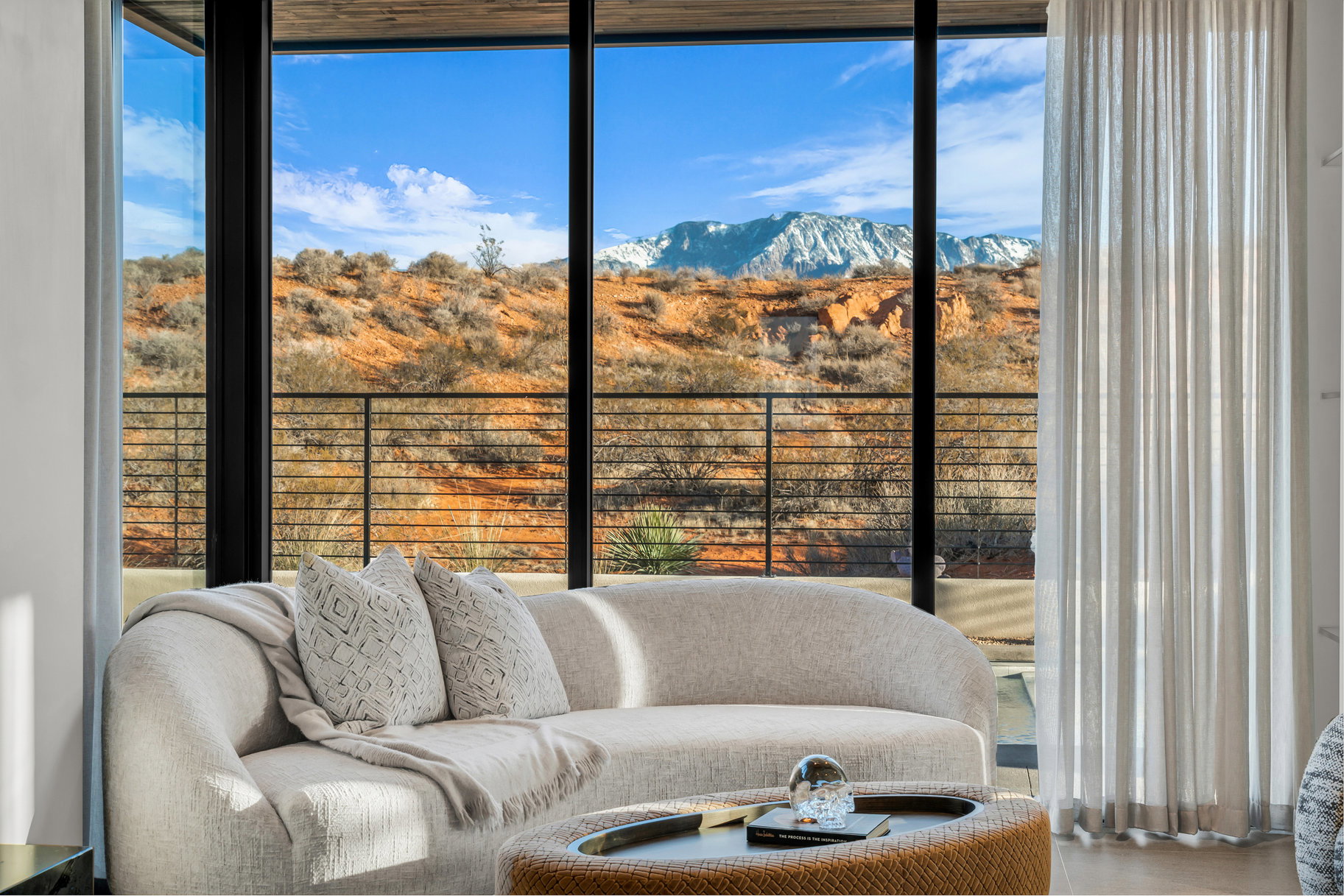 Sunroom with a mountain view