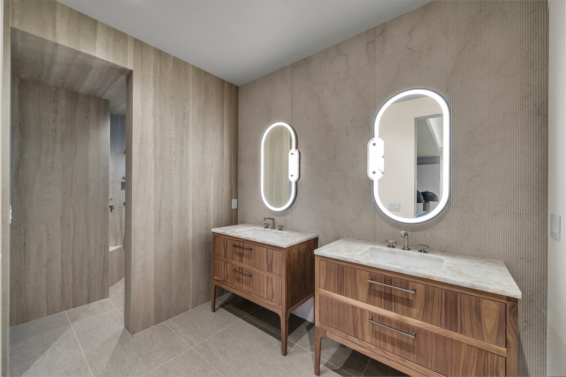 Full bath with two vanities and light tile patterned flooring