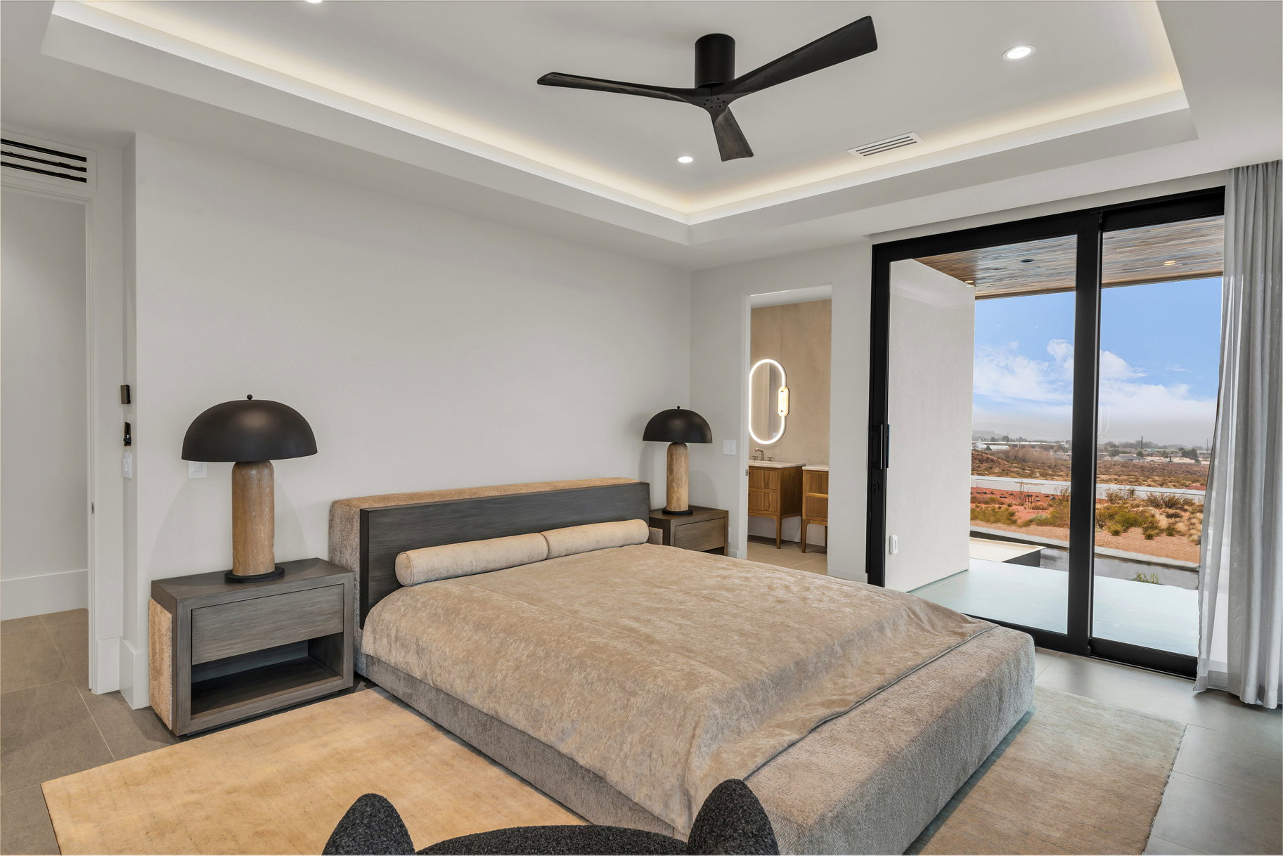 Bedroom featuring access to outside, a raised ceiling, recessed lighting, expansive windows, and a ceiling fan
