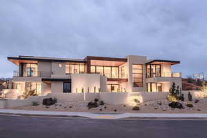 Contemporary home featuring stucco siding