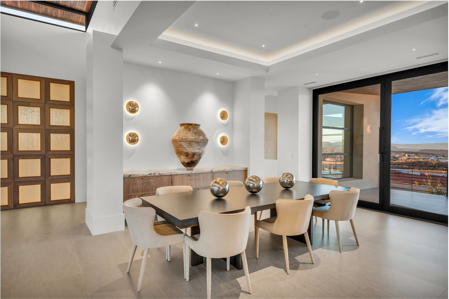 Dining area featuring expansive windows, recessed lighting, and a raised ceiling