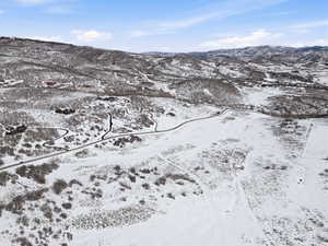 Snowy aerial view with a mountain view