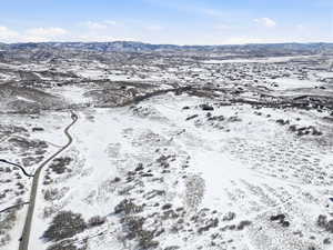 Snowy aerial view featuring a mountain view