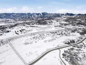 Snowy aerial view with a mountain view