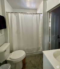 Bathroom featuring vanity and curtained shower