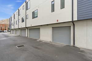 View of building exterior featuring an attached garage