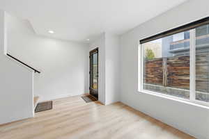 Entrance foyer featuring light wood-style floors and recessed lighting