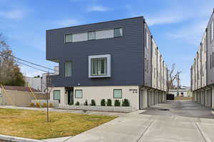 Contemporary home featuring stucco siding