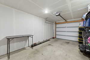 Garage featuring a garage door opener