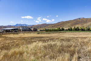 View of mountain background featuring rural landscape